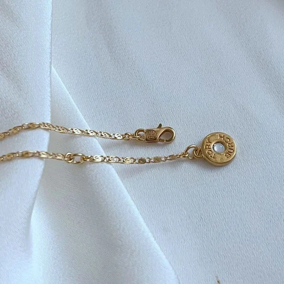 Tory Burch Elegant Gold Necklace with Heart and Disc Charms - Picture 7 of 7